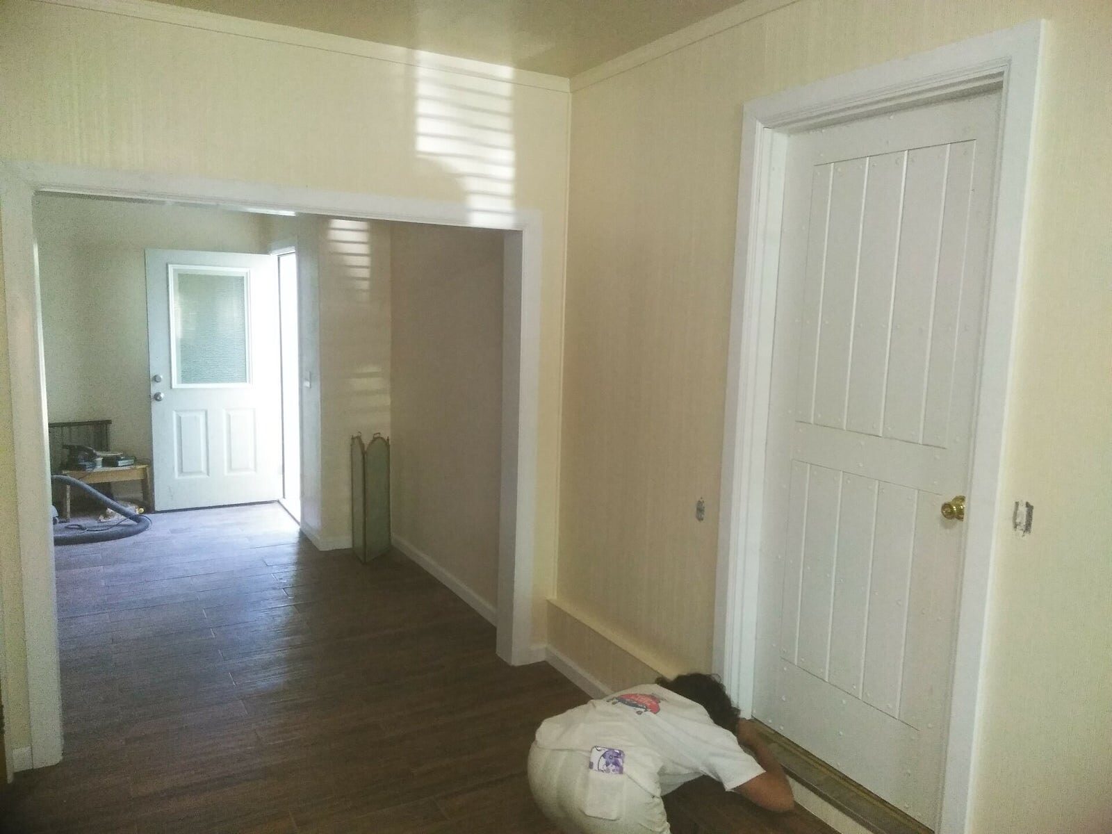 Bright, freshly painted white interior hallway and trim